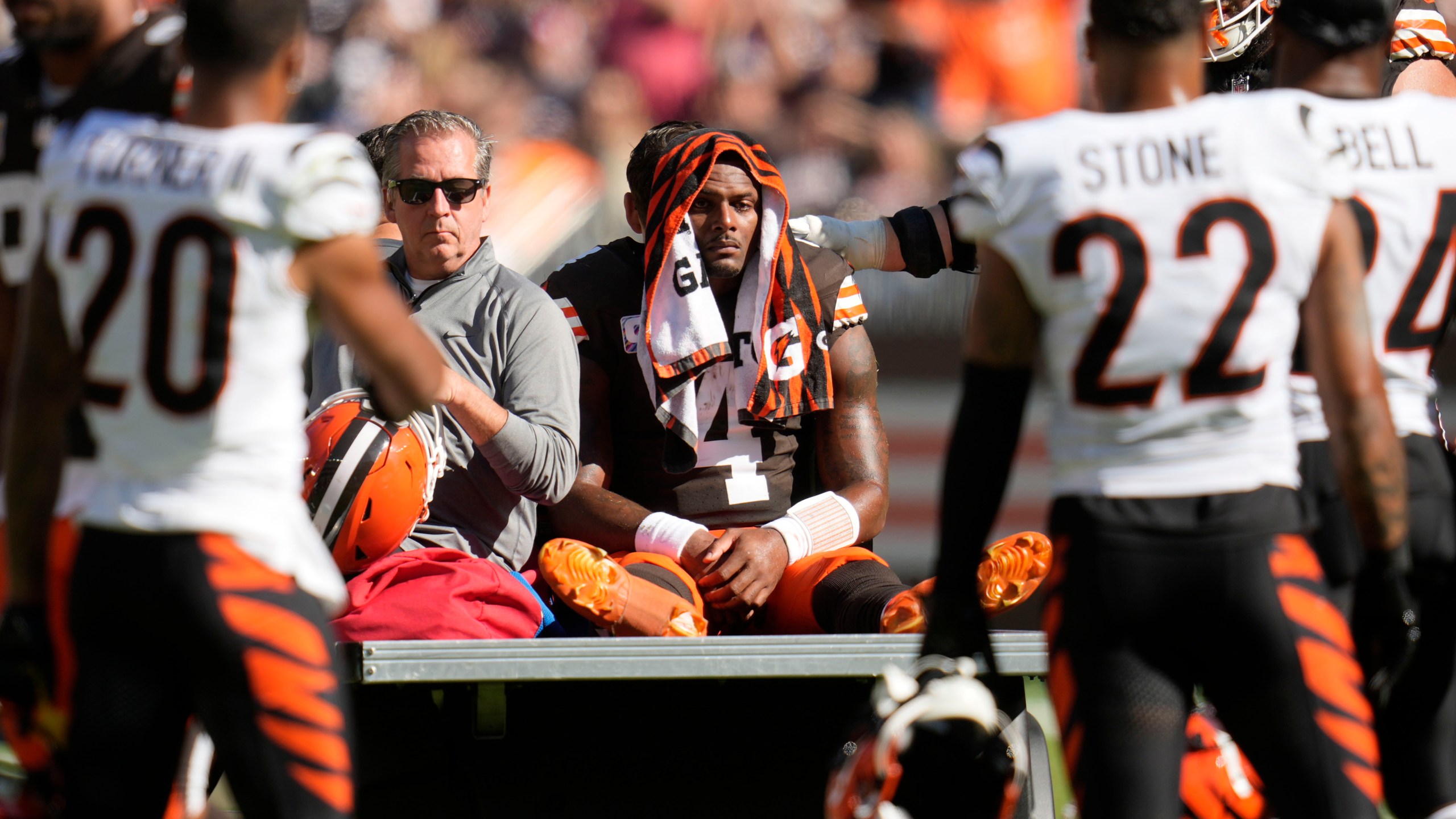 Cleveland Browns quarterback Deshaun Watson (4) is carted off the field after being injured in the first half of an NFL football game against the Cincinnati Bengals, Sunday, Oct. 20, 2024, in Cleveland. (AP Photo/Sue Ogrocki)