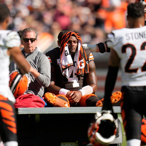 Cleveland Browns quarterback Deshaun Watson (4) is carted off the field after being injured in the first half of an NFL football game against the Cincinnati Bengals, Sunday, Oct. 20, 2024, in Cleveland. (AP Photo/Sue Ogrocki)