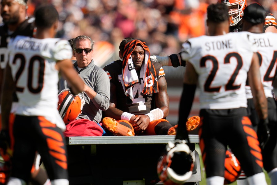 Cleveland Browns quarterback Deshaun Watson (4) is carted off the field after being injured in the first half of an NFL football game against the Cincinnati Bengals, Sunday, Oct. 20, 2024, in Cleveland. (AP Photo/Sue Ogrocki)