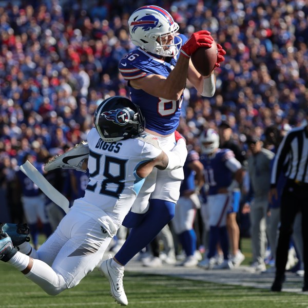 Buffalo Bills tight end Dalton Kincaid (86) makes a catch over Tennessee Titans safety Quandre Diggs (28) during the second half of an NFL football game Sunday, Oct. 20, 2024, in Orchard Park, N.Y. (AP Photo/Jeffrey T. Barnes)