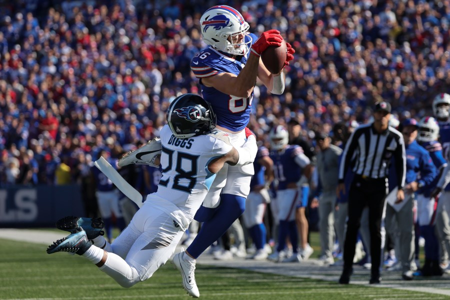 Buffalo Bills tight end Dalton Kincaid (86) makes a catch over Tennessee Titans safety Quandre Diggs (28) during the second half of an NFL football game Sunday, Oct. 20, 2024, in Orchard Park, N.Y. (AP Photo/Jeffrey T. Barnes)