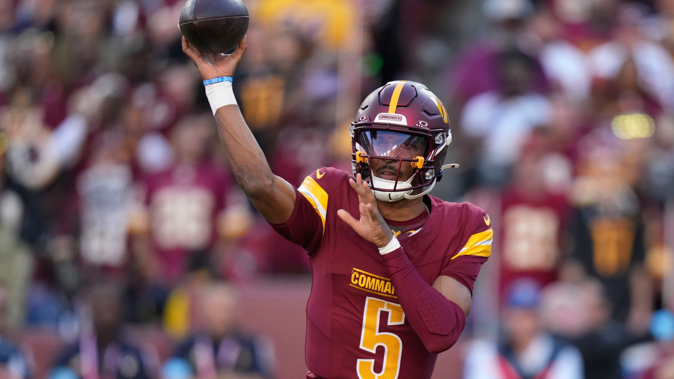 Washington Commanders quarterback Jayden Daniels throws a pass during the first half of an NFL football game against the Carolina Panthers, Sunday, Oct. 20, 2024, in Landover, Md. (AP Photo/Stephanie Scarbrough)