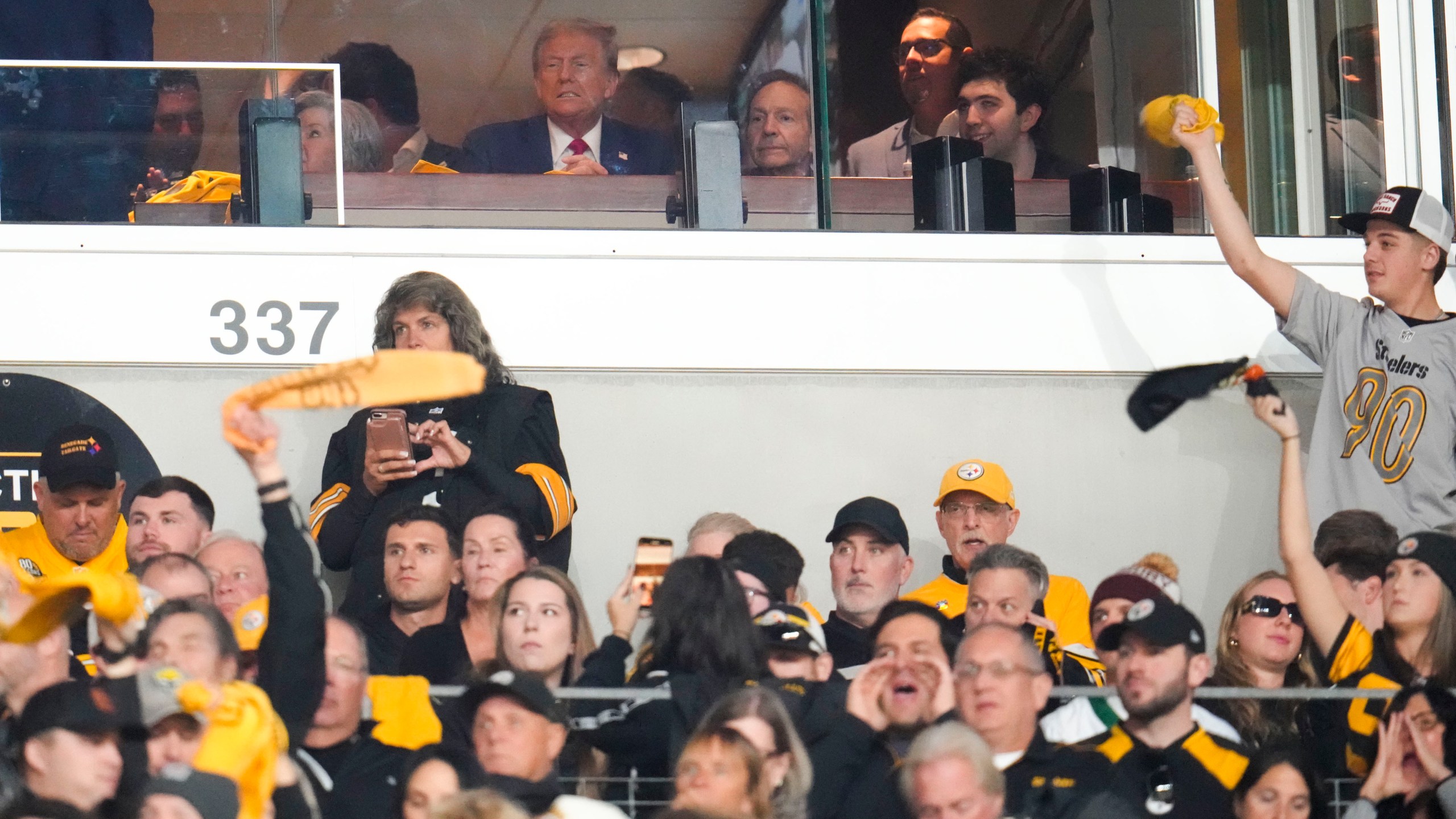 Republican presidential nominee former President Donald Trump watches the first half of an NFL football game between the Pittsburgh Steelers and the New York Jets in Pittsburgh, Sunday, Oct. 20, 2024. (AP Photo/Gene J. Puskar)