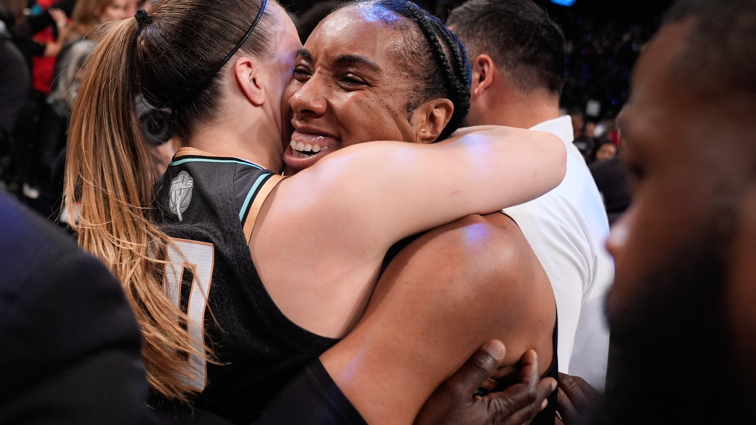 New York Liberty forward Kayla Thornton (5) hugs guard Sabrina Ionescu (20) after the Liberty defeated the Minnesota Lynx in Game 5 of the WNBA basketball final series to win the championship, Sunday, Oct. 20, 2024, in New York. (AP Photo/Pamela Smith)