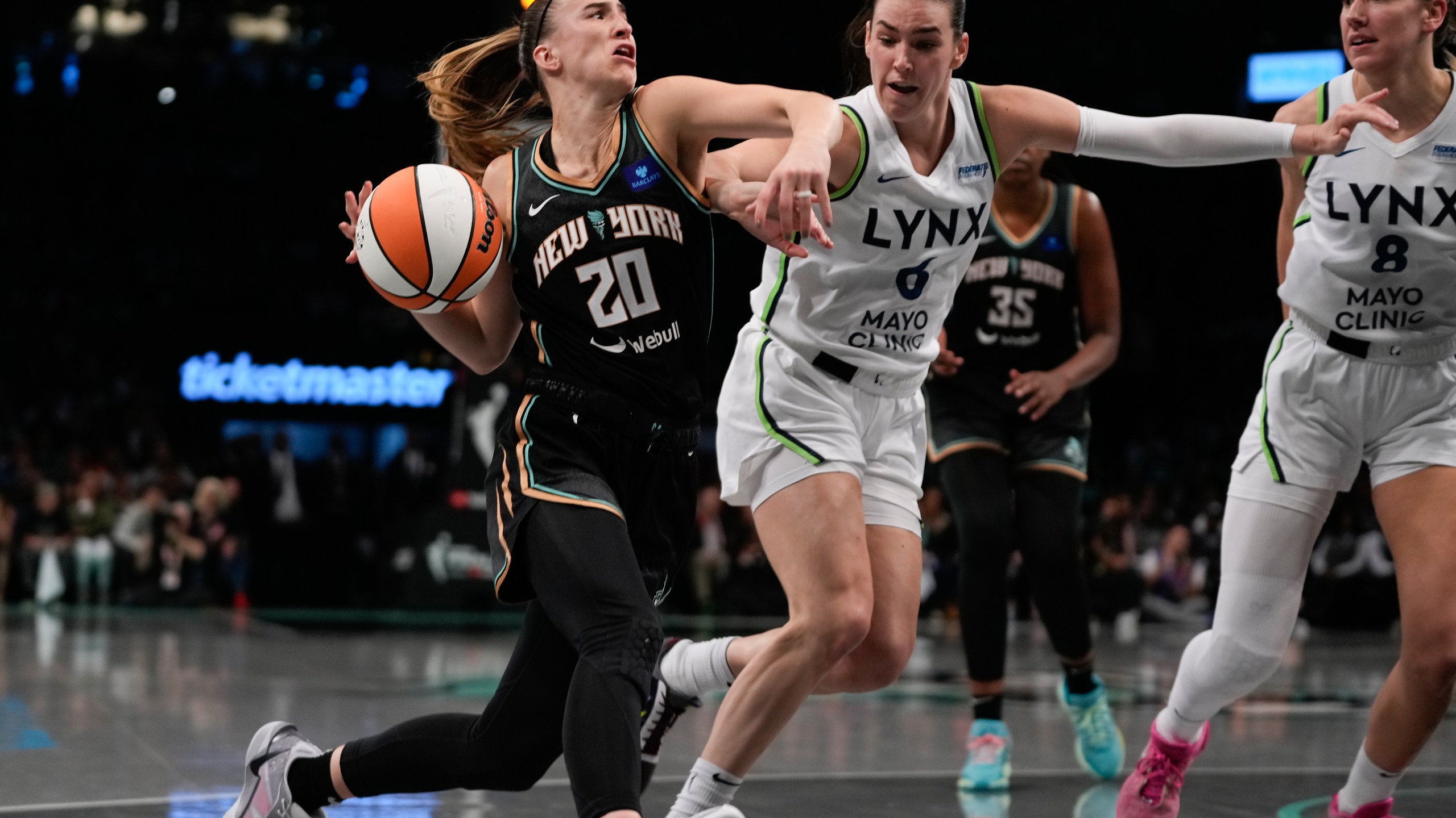 New York Liberty guard Sabrina Ionescu (20) drives against Minnesota Lynx forward Bridget Carleton (6) during the second quarter of Game 5 of the WNBA basketball final series, Sunday, Oct. 20, 2024, in New York. (AP Photo/Pamela Smith)