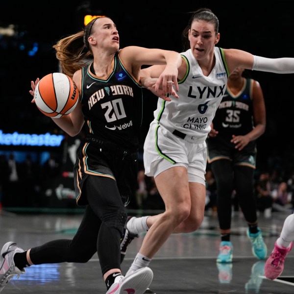 New York Liberty guard Sabrina Ionescu (20) drives against Minnesota Lynx forward Bridget Carleton (6) during the second quarter of Game 5 of the WNBA basketball final series, Sunday, Oct. 20, 2024, in New York. (AP Photo/Pamela Smith)