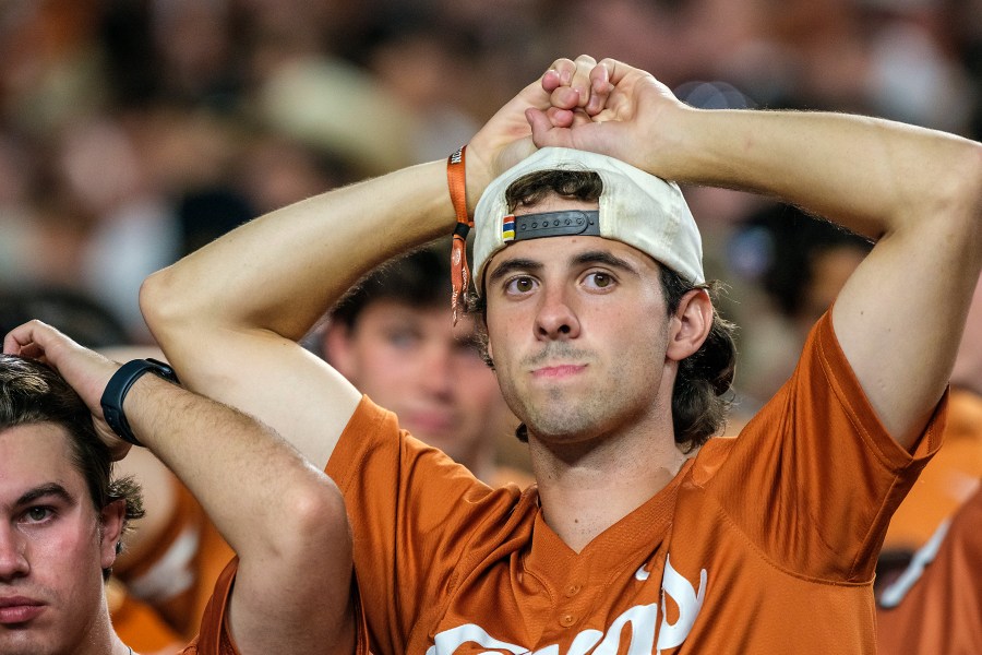 Texas fans watch the clock run out during the second half of an NCAA college football game against Georgia in Austin, Texas, Saturday, Oct. 19, 2024. (AP Photo/Rodolfo Gonzalez)