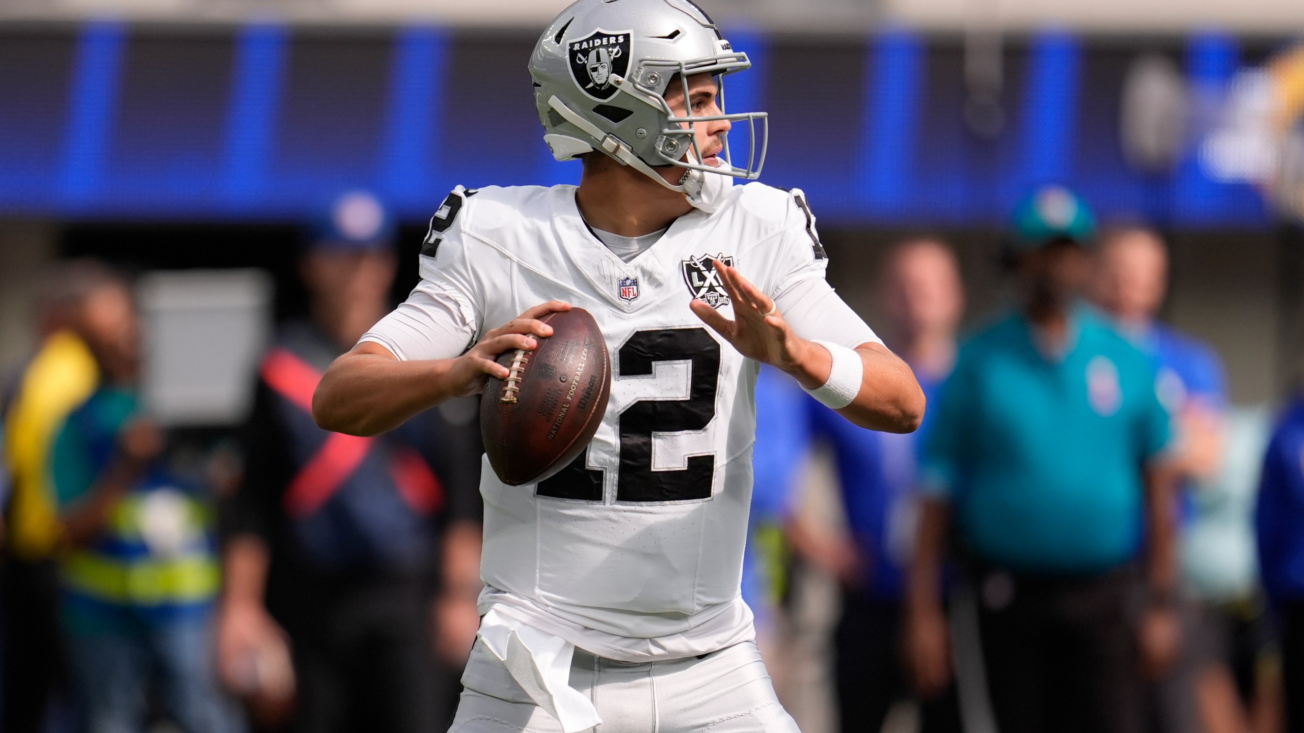 Las Vegas Raiders quarterback Aidan O'Connell (12) looks to pass during the first half of an NFL football game against the Los Angeles Rams, Sunday, Oct. 20, 2024, in Inglewood, Calif. (AP Photo/Marcio Jose Sanchez)