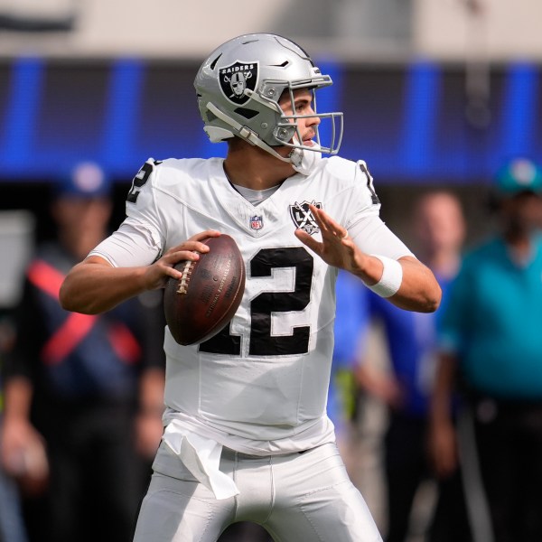 Las Vegas Raiders quarterback Aidan O'Connell (12) looks to pass during the first half of an NFL football game against the Los Angeles Rams, Sunday, Oct. 20, 2024, in Inglewood, Calif. (AP Photo/Marcio Jose Sanchez)