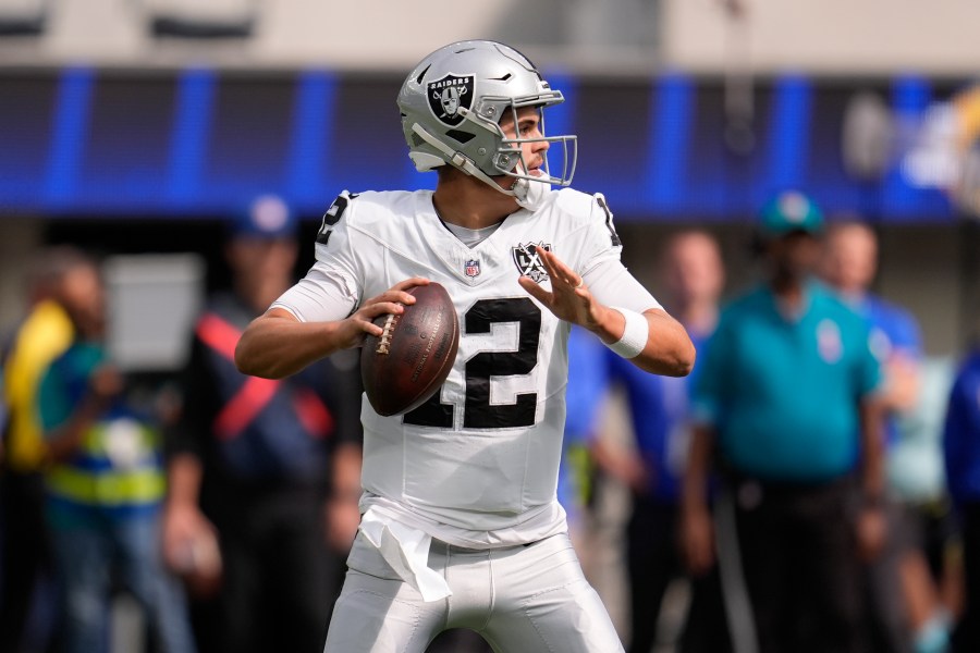 Las Vegas Raiders quarterback Aidan O'Connell (12) looks to pass during the first half of an NFL football game against the Los Angeles Rams, Sunday, Oct. 20, 2024, in Inglewood, Calif. (AP Photo/Marcio Jose Sanchez)