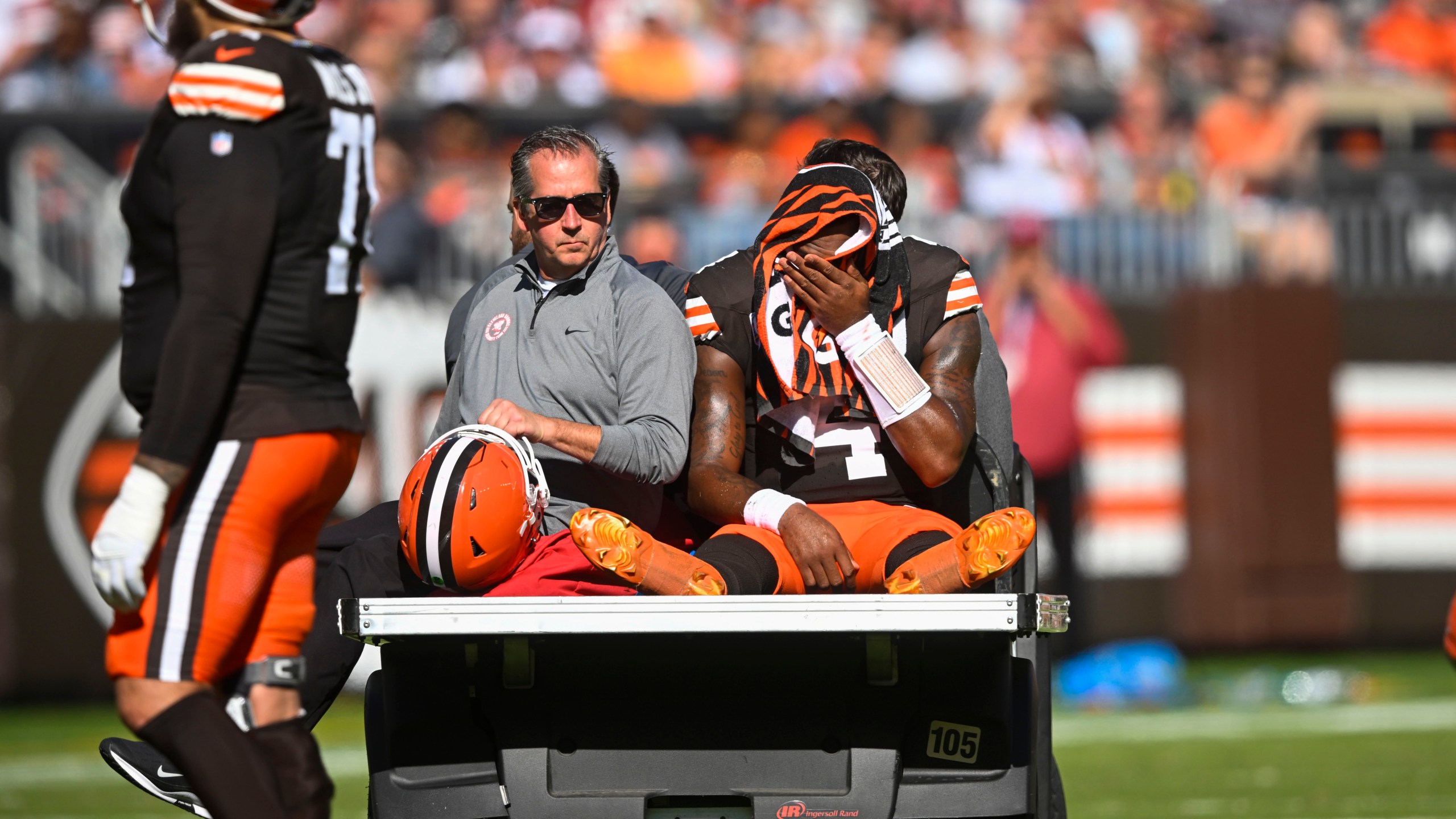 Cleveland Browns quarterback Deshaun Watson (4) is carted off the field after being injured in the first half of an NFL football game against the Cincinnati Bengals, Sunday, Oct. 20, 2024, in Cleveland. (AP Photo/David Richard)