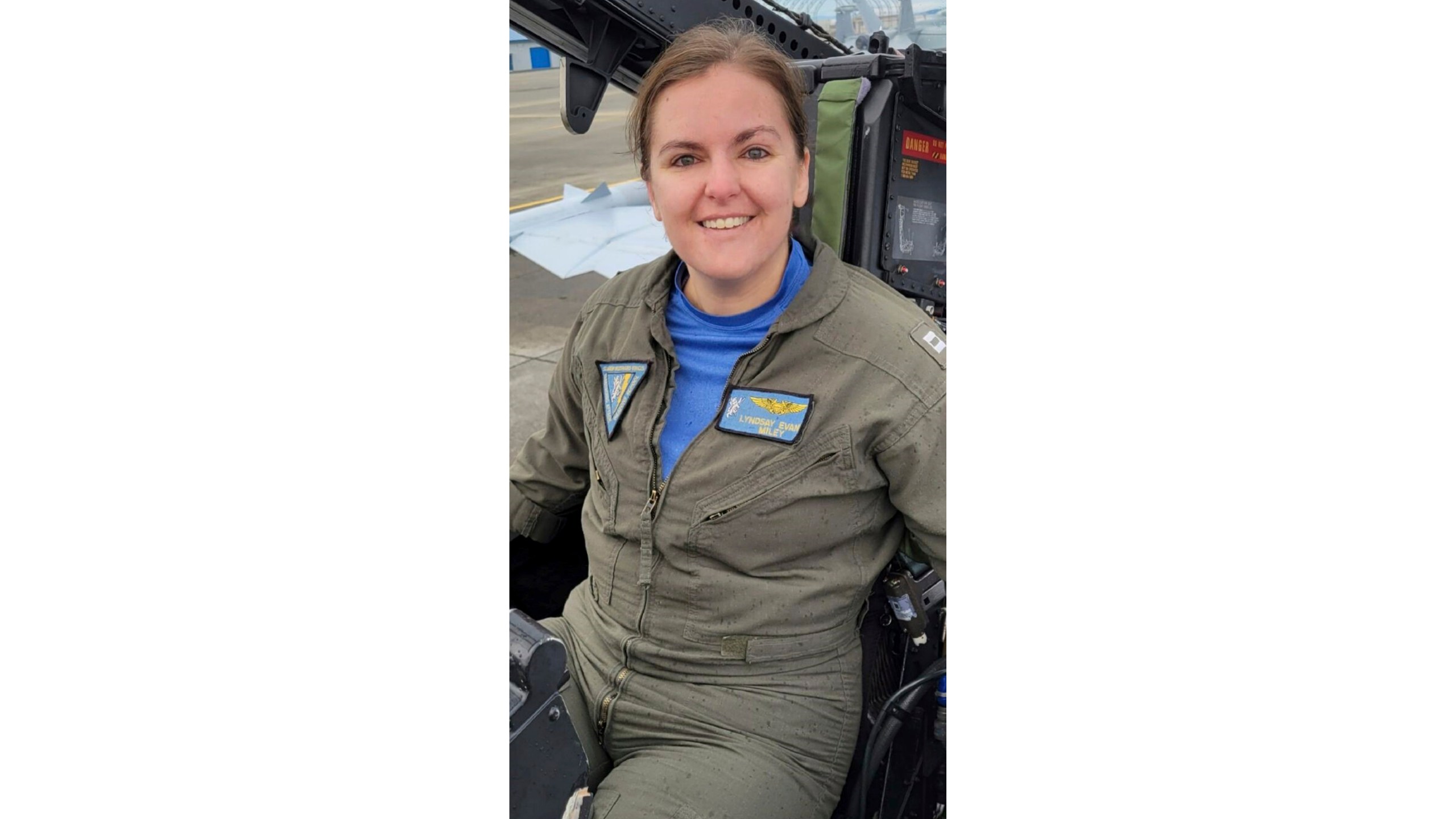 In this undated photo released by the U.S. Navy, Lt. Commander Lyndsay Evans, a Naval Flight Officer, sits in a cockpit. (U.S. Navy via AP)