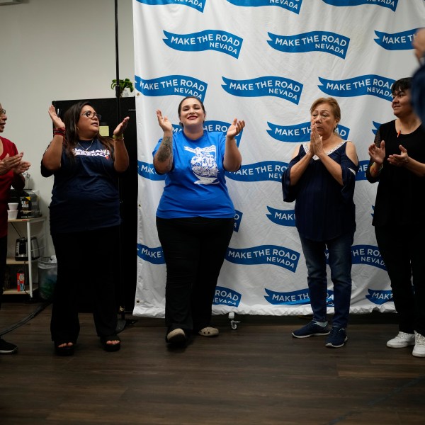 Erika Marquez, center, leads a meeting at the nonprofit Make the Road Nevada, where she works as the immigration and justice organizer, Thursday, Sept. 12, 2024, in Las Vegas. Marquez is a recipient of an Obama administration amnesty for immigrants brought to the U.S. illegally as children. (AP Photo/John Locher)