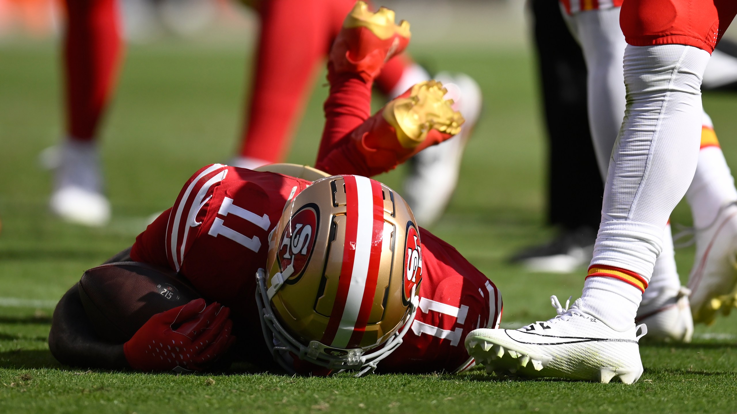 San Francisco 49ers wide receiver Brandon Aiyuk (11) remains on the field after being hit during the first half of an NFL football game against the Kansas City Chiefs in Santa Clara, Calif., Sunday, Oct. 20, 2024. (AP Photo/Eakin Howard)