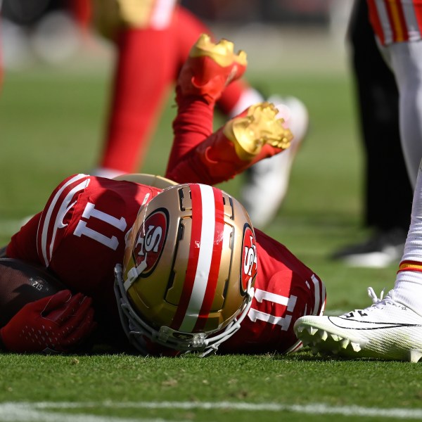 San Francisco 49ers wide receiver Brandon Aiyuk (11) remains on the field after being hit during the first half of an NFL football game against the Kansas City Chiefs in Santa Clara, Calif., Sunday, Oct. 20, 2024. (AP Photo/Eakin Howard)