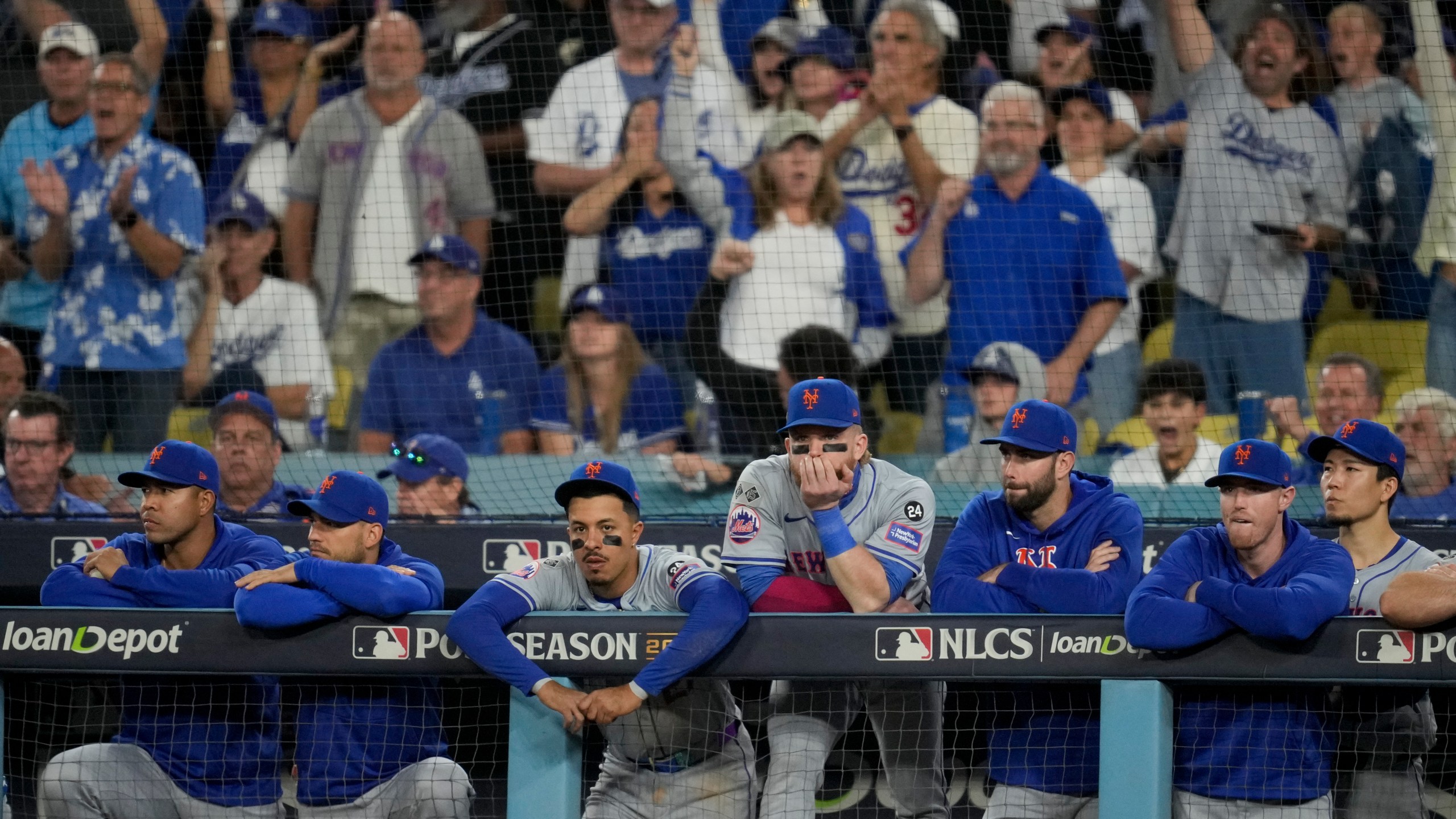 New York Mets react to their loss against the Los Angeles Dodgers in Game 6 of a baseball NL Championship Series, Sunday, Oct. 20, 2024, in Los Angeles. The Dodgers will face the New York Yankees in the World Series. (AP Photo/Ashley Landis)