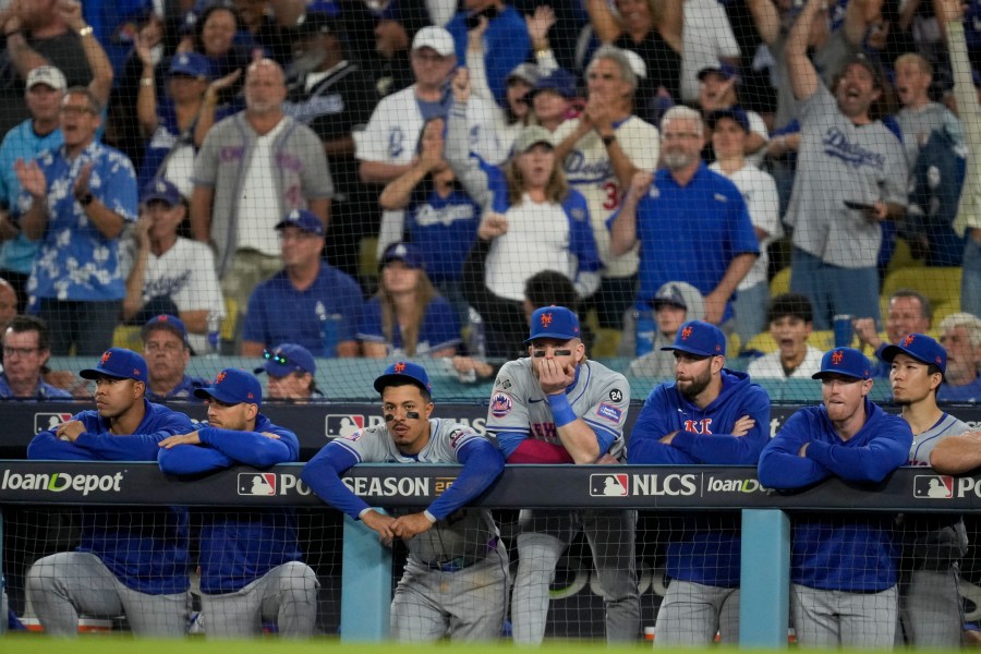 New York Mets react to their loss against the Los Angeles Dodgers in Game 6 of a baseball NL Championship Series, Sunday, Oct. 20, 2024, in Los Angeles. The Dodgers will face the New York Yankees in the World Series. (AP Photo/Ashley Landis)