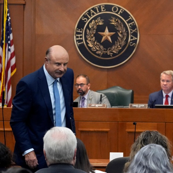 Dr. Phil McGraw stands as he leaves the room after giving testimony to a committee discussing the case of death row inmate Robert Roberson, Monday, Oct. 21, 2024, in Austin, Texas. (AP Photo/Tony Gutierrez)