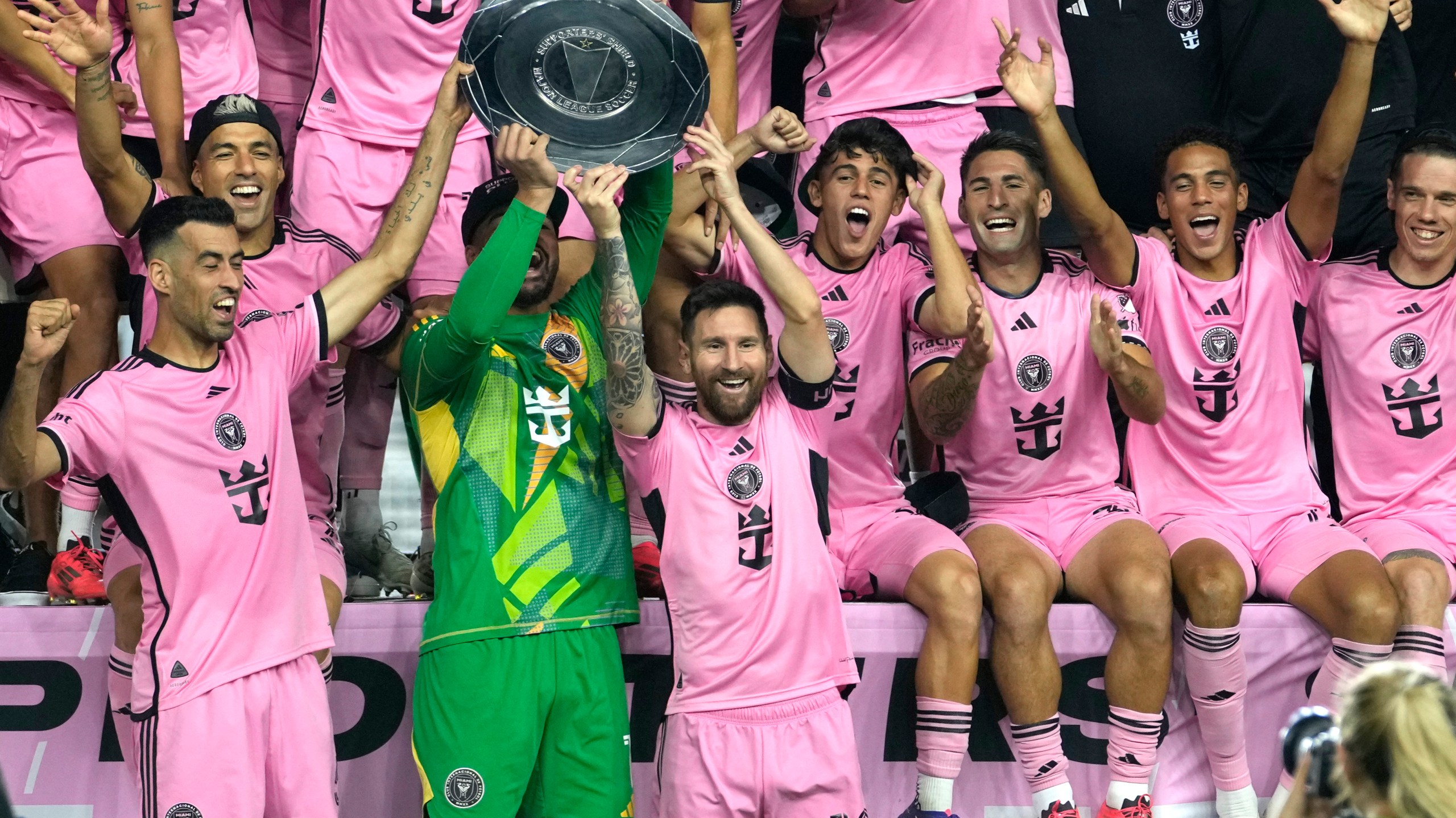 Inter Miami forward Lionel Messi (10) celebrates with his teammates during a ceremony for winning the Supporters' Shield after an MLS soccer match against the New England Revolution, Saturday, Oct. 19, 2024, in Fort Lauderdale, Fla. (AP Photo/Lynne Sladky)