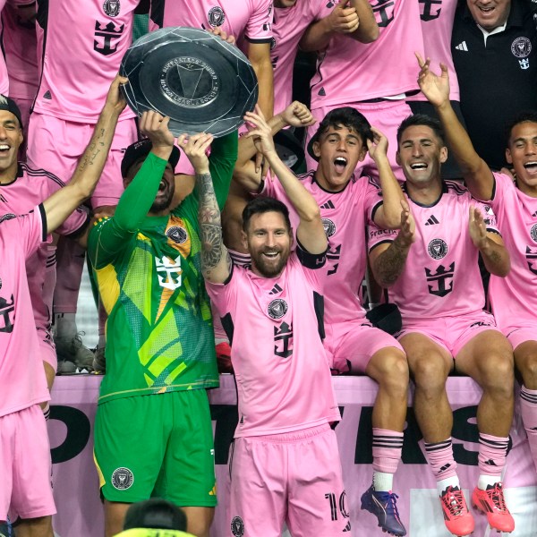 Inter Miami forward Lionel Messi (10) celebrates with his teammates during a ceremony for winning the Supporters' Shield after an MLS soccer match against the New England Revolution, Saturday, Oct. 19, 2024, in Fort Lauderdale, Fla. (AP Photo/Lynne Sladky)