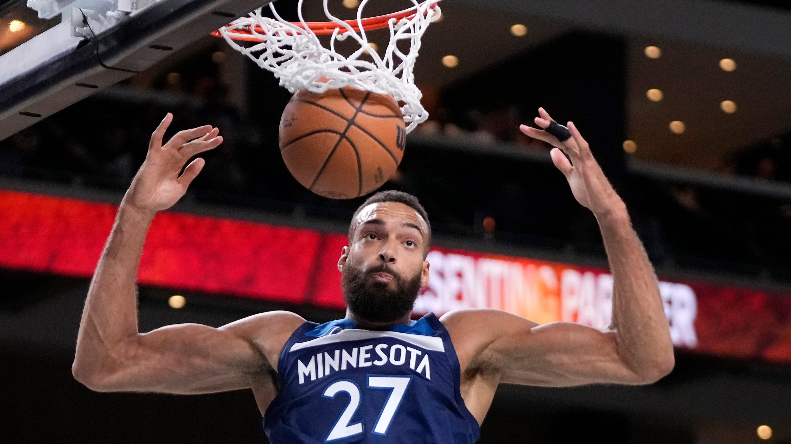 Minnesota Timberwolves center Rudy Gobert dunks during the first half of a preseason NBA basketball game against the Los Angeles Lakers, Friday, Oct. 4, 2024, in Palm Desert, Calif. (AP Photo/Mark J. Terrill)