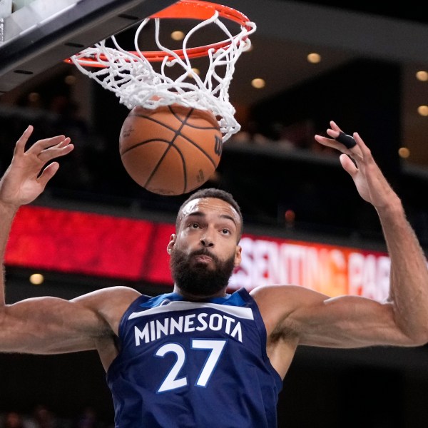 Minnesota Timberwolves center Rudy Gobert dunks during the first half of a preseason NBA basketball game against the Los Angeles Lakers, Friday, Oct. 4, 2024, in Palm Desert, Calif. (AP Photo/Mark J. Terrill)