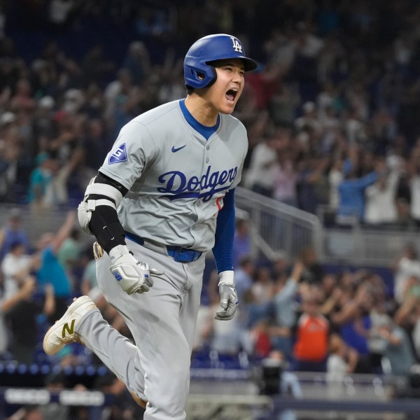 Los Angeles Dodgers' Shohei Ohtani (17) reacts after hitting his 50th home run of the season during the seventh inning of a baseball game against the Miami Marlins, Thursday, Sept. 19, 2024, in Miami. (AP Photo/Marta Lavandier)