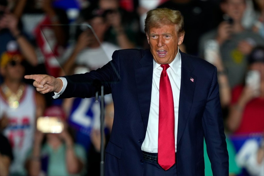 Republican presidential nominee former President Donald Trump gestures to supporters at a campaign rally at Greensboro Coliseum, Tuesday, Oct. 22, 2024, in Greensboro, N.C. (AP Photo/Julia Demaree Nikhinson)