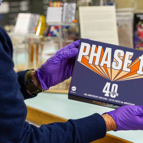 Christopher Bensch, chief curator at The Strong National Museum of Play, holds one of the games that is a finalist for the 2024 Toy Hall of Fame, Tuesday, Oct. 15, 2024, in Rochester, N.Y. (AP Photo/Lauren Petracca)