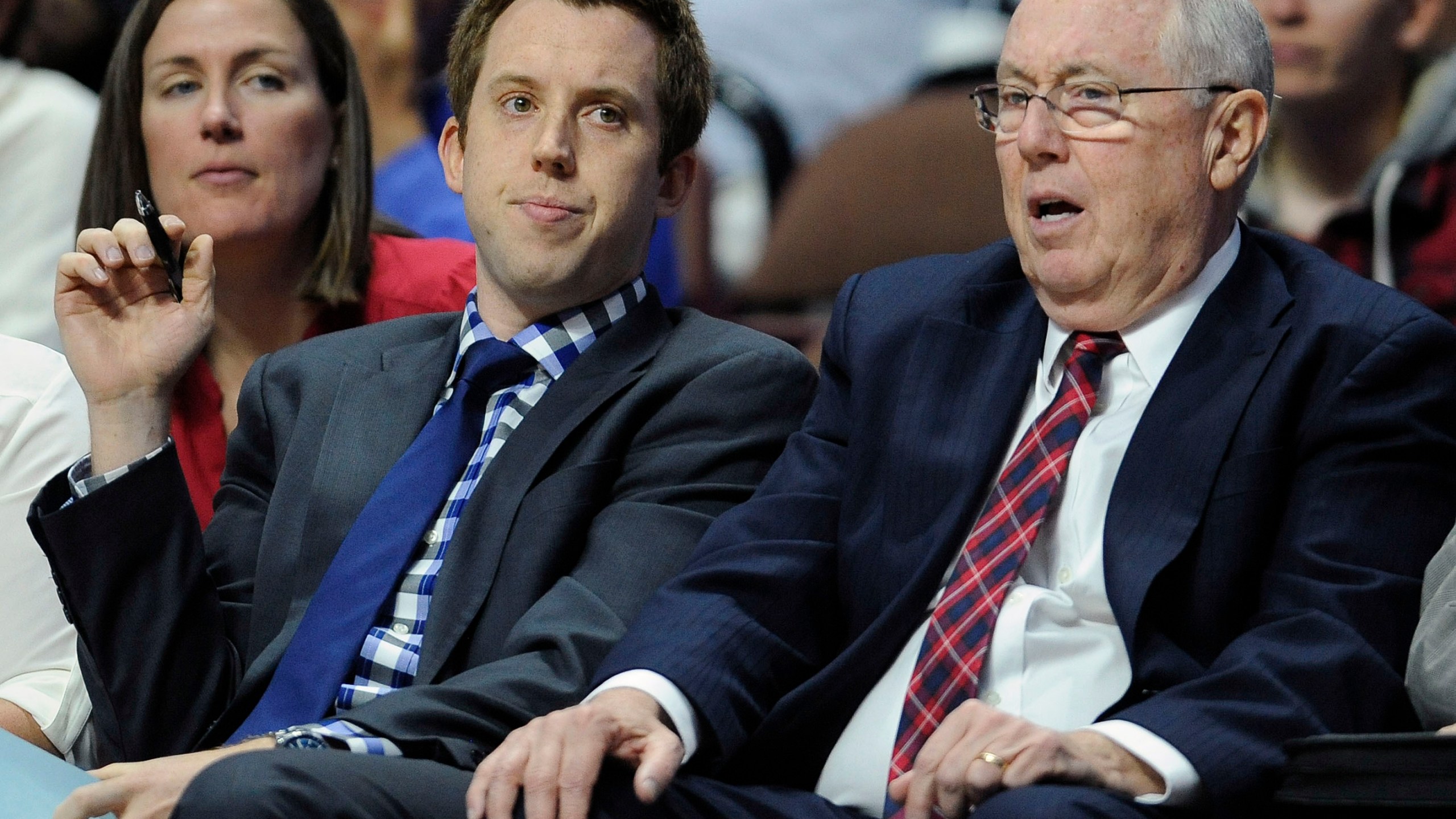 FILE - Washington Mystics head coach Mike Thibault, right, sits with his son assistant coach Eric Thibault, left, during the first half of a WNBA basketball game, June 14, 2016, in Uncasville, Conn. (AP Photo/Jessica Hill, File)