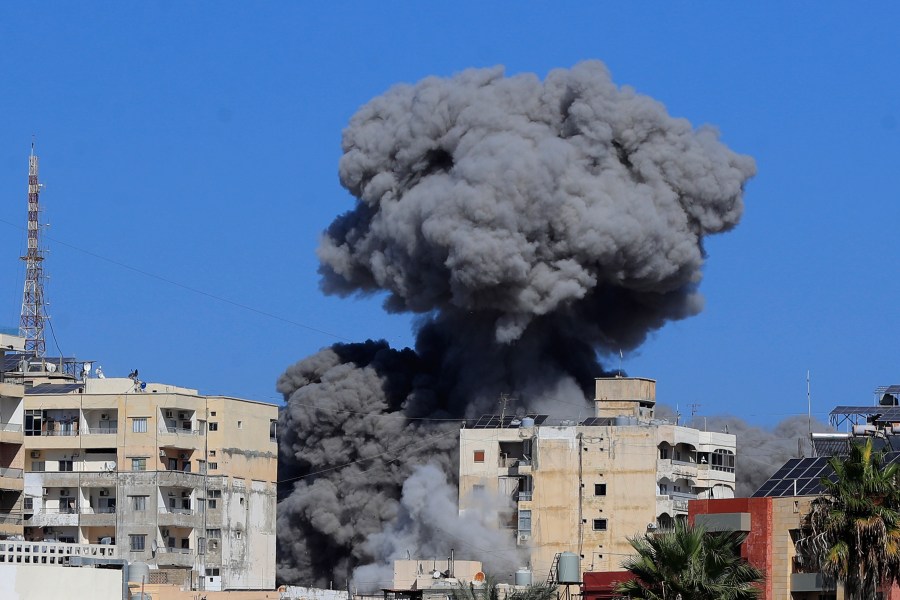 Smoke rises from buildings hit in an Israeli airstrike in Tyre, Lebanon, Wednesday, Oct. 23, 2024. (AP Photo/Mohammad Zaatari)