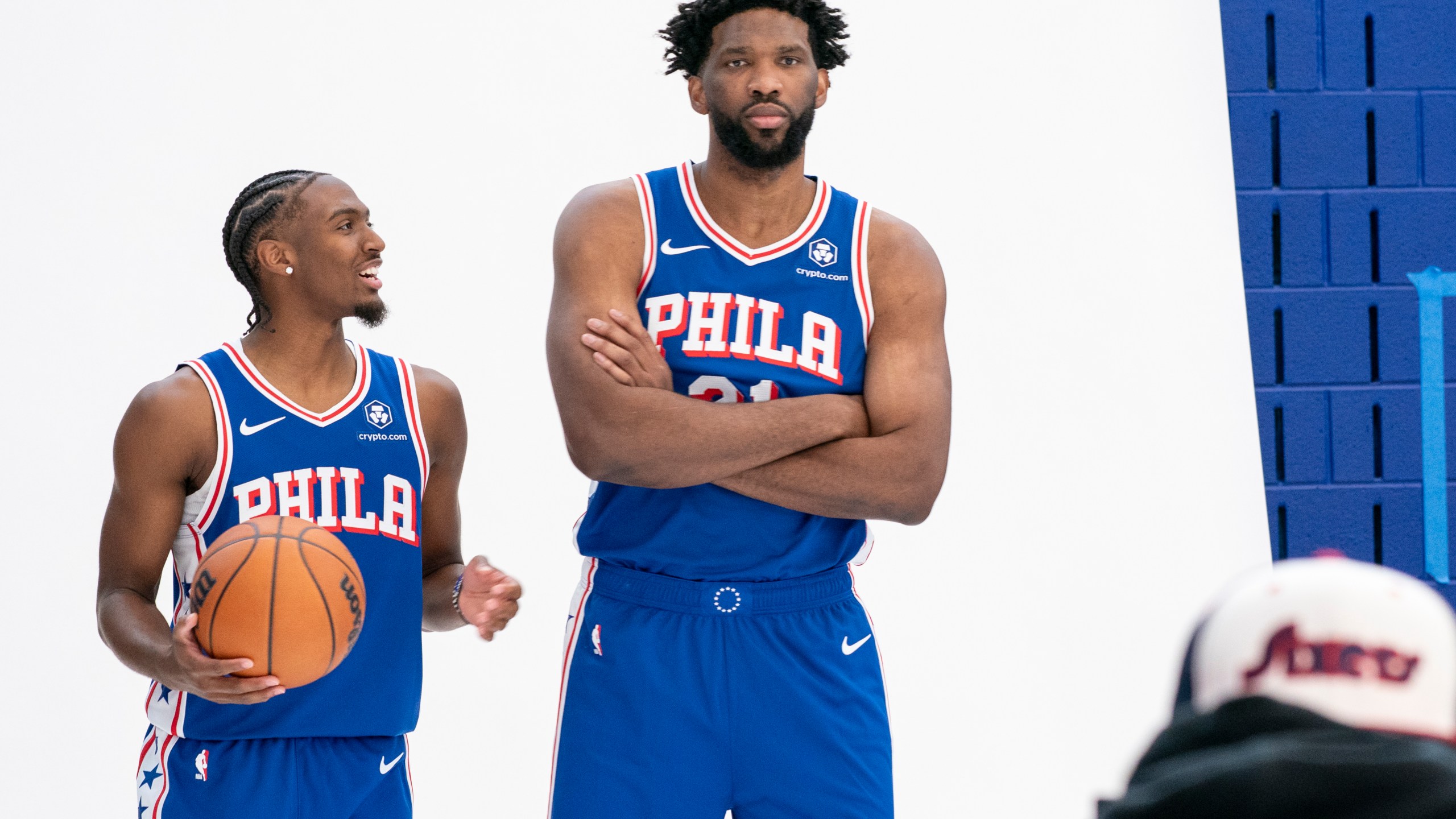 Philadelphia 76ers' Tyrese Maxey, left, reacts as he poses with Joel Embiid, right, for photos during the NBA basketball team's media day, Monday, Sept. 30, 2024, in Camden, N.J.. (AP Photo/Chris Szagola)