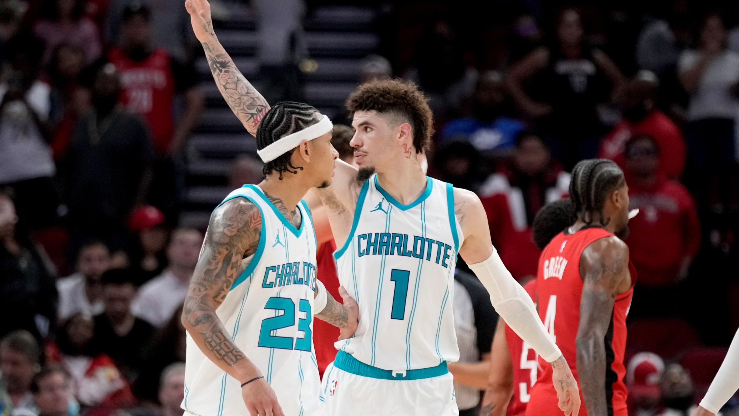 Charlotte Hornets guard LaMelo Ball (1) waves to fans near the end of an NBA basketball game against the Houston Rockets, Wednesday, Oct. 23, 2024, in Houston. (AP Photo/Eric Christian Smith)