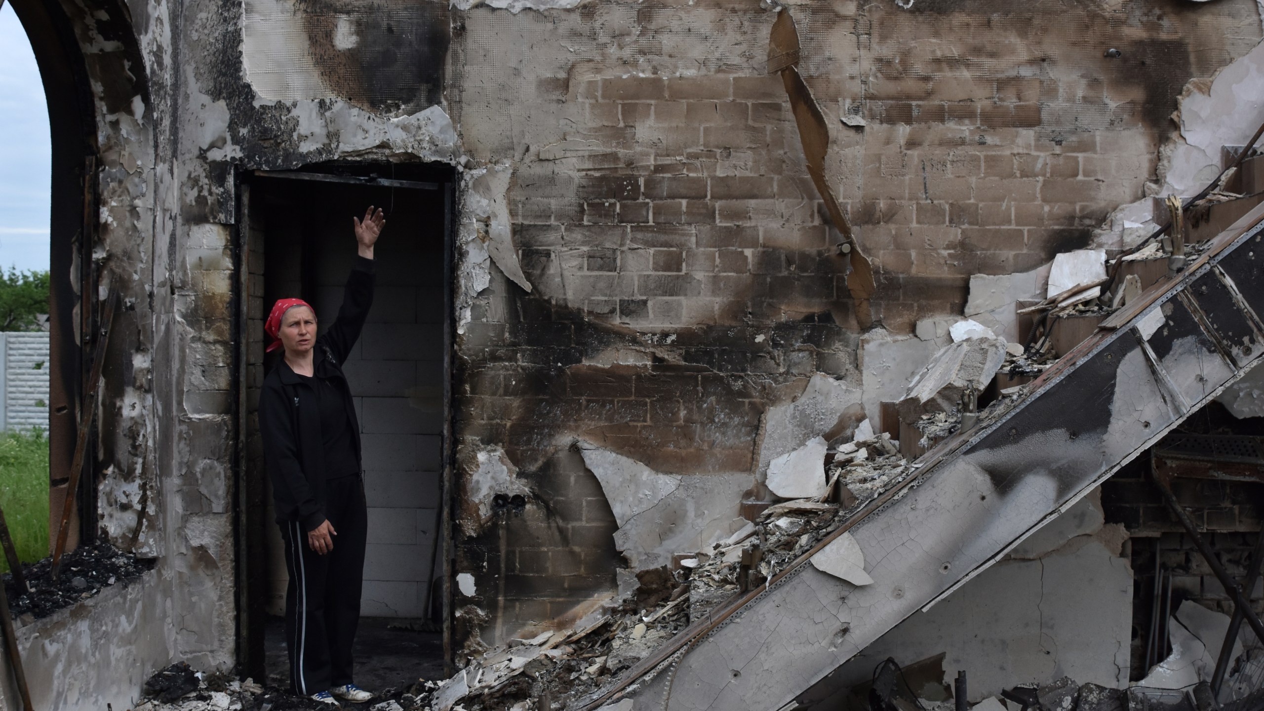 FILE - Valentina, 53, a local woman, stands inside the Evangelical Christian Baptists prayer house in Orihiv, Ukraine, on Monday, May 22, 2023, which was destroyed the previous day by a Russian attack. (AP Photo/Andriy Andriyenko, File)