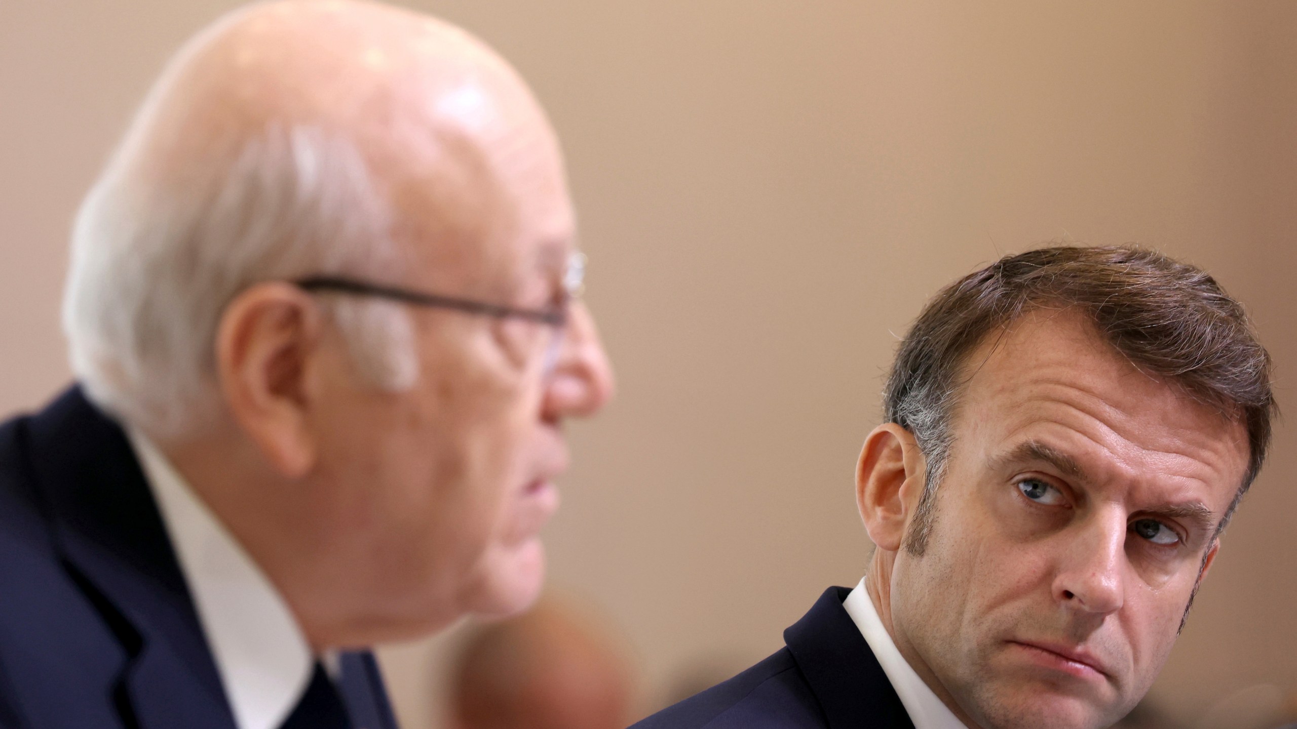 French President Emmanuel Macron listens to Lebanon's Prime Minister caretaker Prime Minister Najib Mikati, left, during international conference for Lebanon in Paris, Thursday, Oct.24, 2024. (Alain Jocard, Pool via AP)