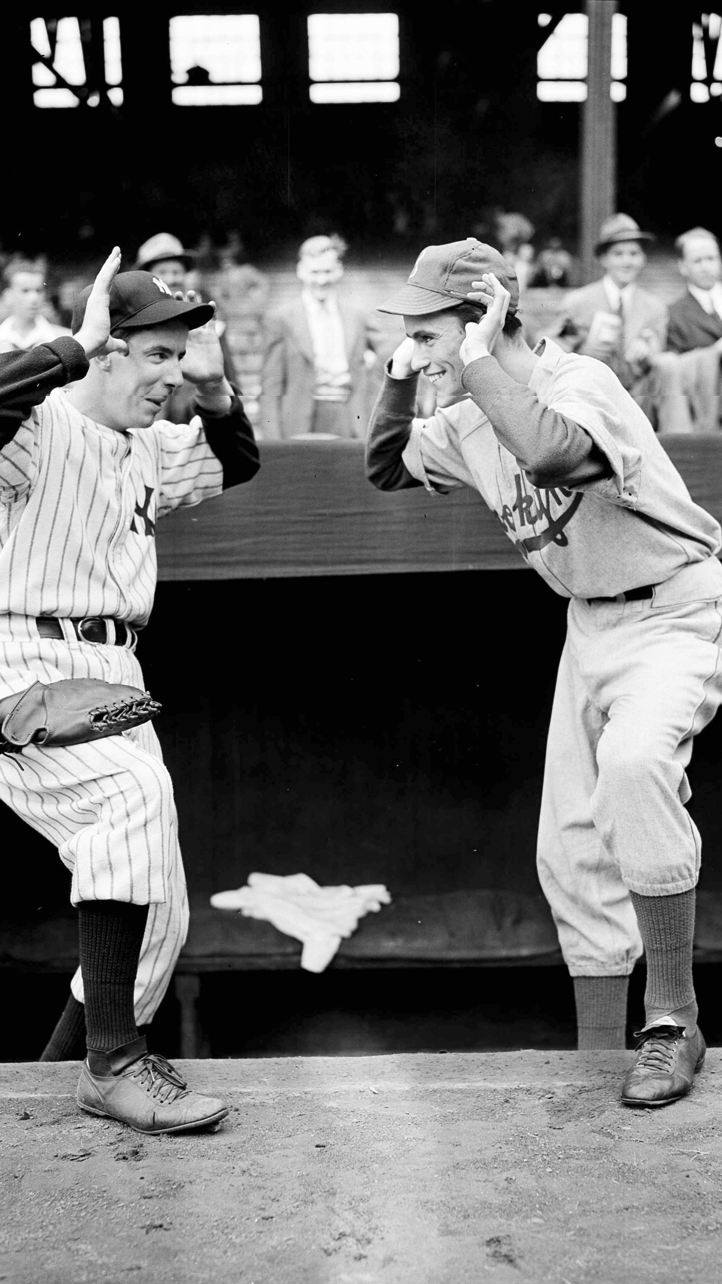 FILE - New York Yankees bat boy Tim Sullivan, left, and Brooklyn Dodgers bat boy Jack Bodner taunt each other as the World Series opened at Yankee Stadium in New York, Oct. 1, 1941. (AP Photo/Tom Sande, File)