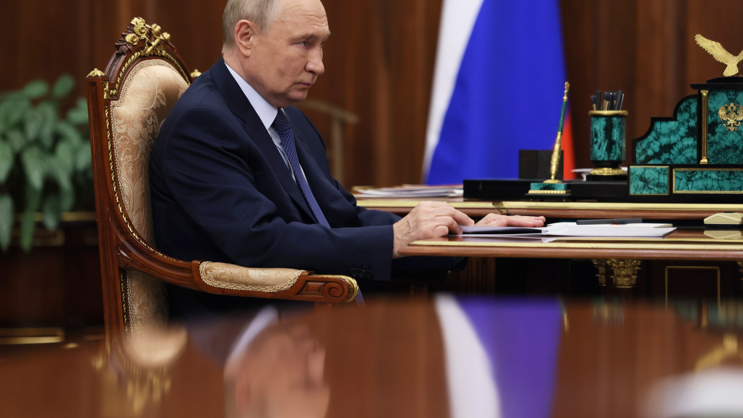 Russian President Vladimir Putin speaks with Head of Federal Customs Service Valery Pikalyov at the Kremlin in Moscow, Russia, Friday, Oct. 25, 2024. (Mikhail Metzel, Sputnik, Kremlin Pool Photo via AP)