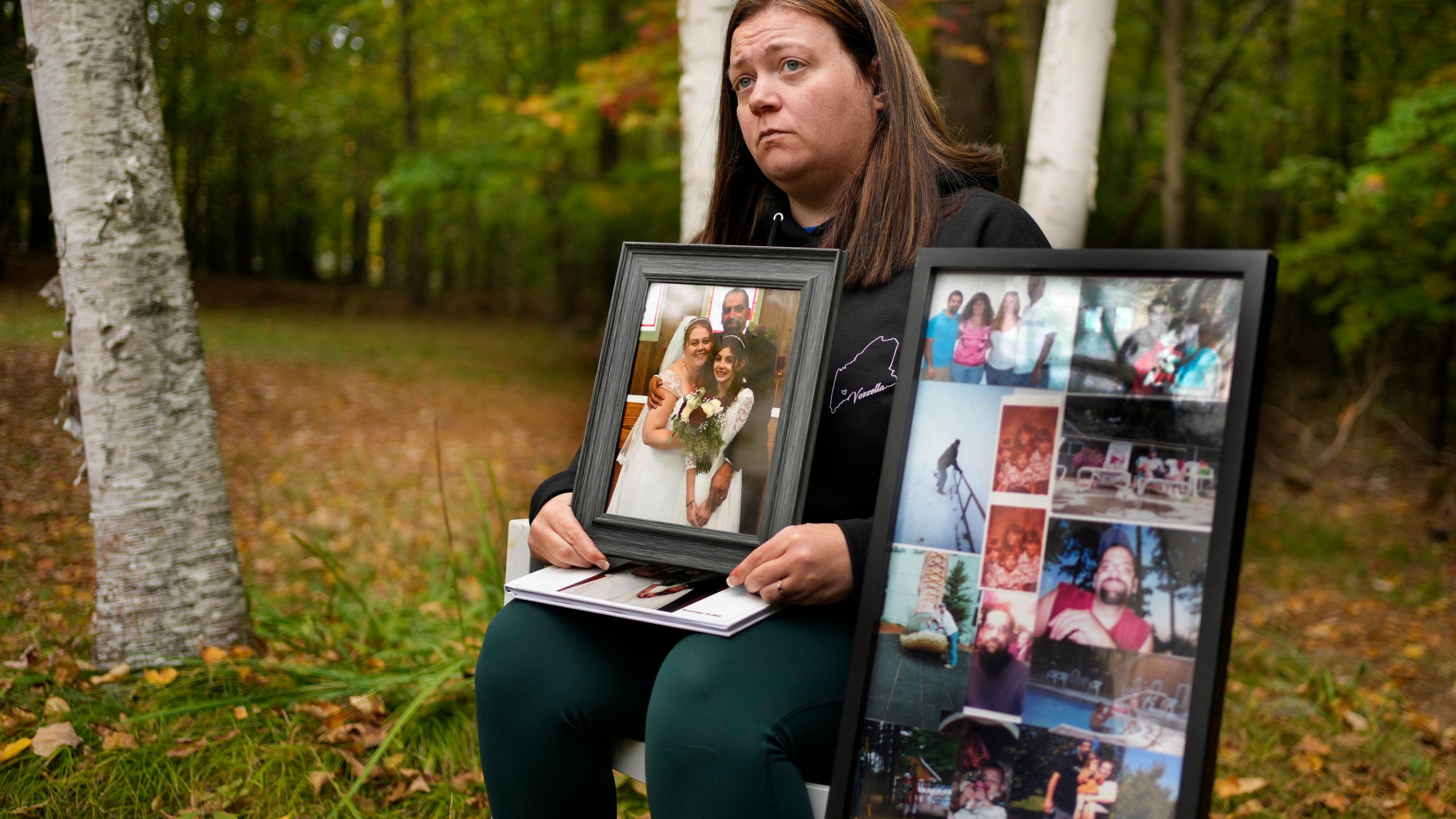 Megan Vozzella shows family photos during an interview about her late husband, Stephen Vozzella, who was one of the people killed in a mass shooting on Oct. 25, 2023, in Lewiston, Tuesday, Oct. 1, 2024, in Oxford, Maine. (AP Photo/Robert F. Bukaty)