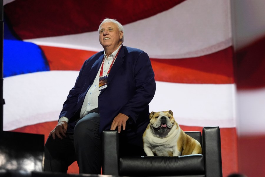 FILE - West Virginia Gov. Jim Justice checks out the stage with his dog, "Babydog," before the Republican National Convention, July 16, 2024, in Milwaukee. (AP Photo/Jae C. Hong, File)