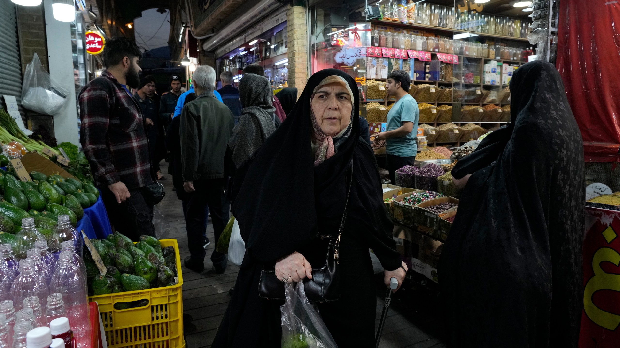 People shop at Tajrish traditional bazaar in northern Tehran, Iran, Saturday, Oct. 26, 2024. (AP Photo/Vahid Salemi)