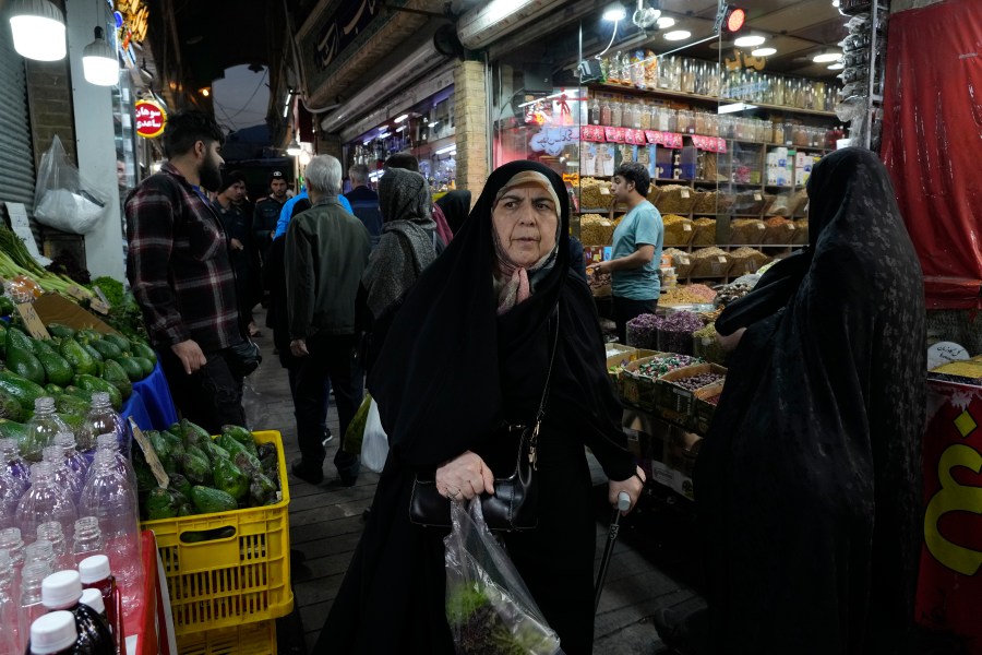 People shop at Tajrish traditional bazaar in northern Tehran, Iran, Saturday, Oct. 26, 2024. (AP Photo/Vahid Salemi)