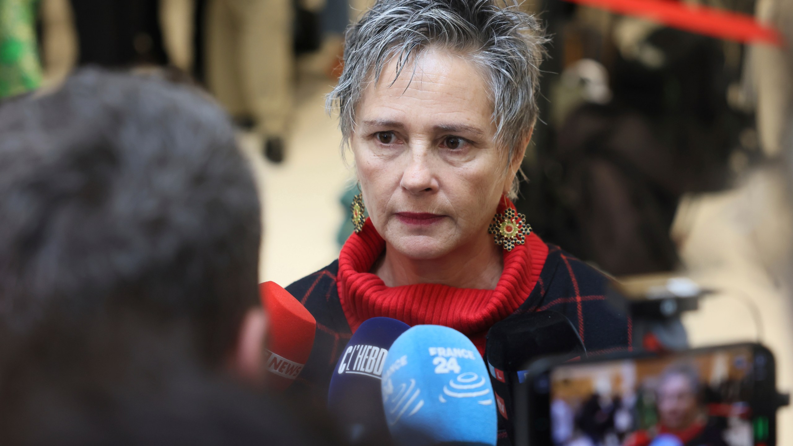 Actress and witness Anouk Grinberg arrives at the courtroom as French actor Gérard Depardieu, who is facing trial for the alleged sexual assaults of two women on a film set in 2021, won't appear before a criminal court, Monday, Oct. 28, 2024 in Paris. (AP Photo/Thomas Padilla)