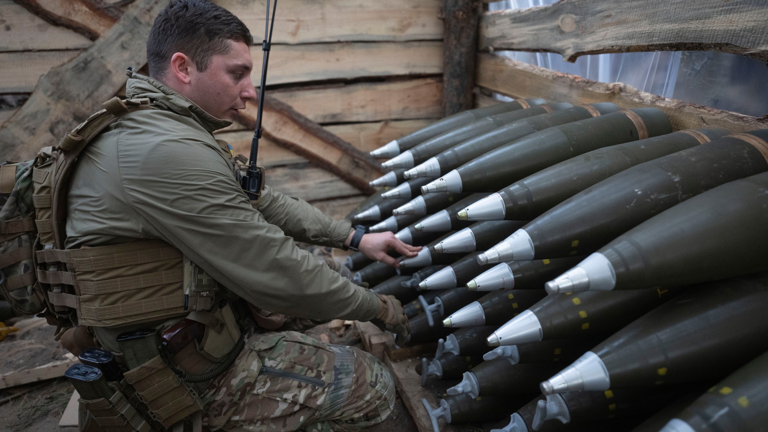 A Ukrainian officer of the 92nd separate assault brigade inspects ammunition in a shelter on the frontline near Vovchansk, Kharkiv region, Ukraine, Monday, Oct. 28, 2024. (AP Photo/Efrem Lukatsky)