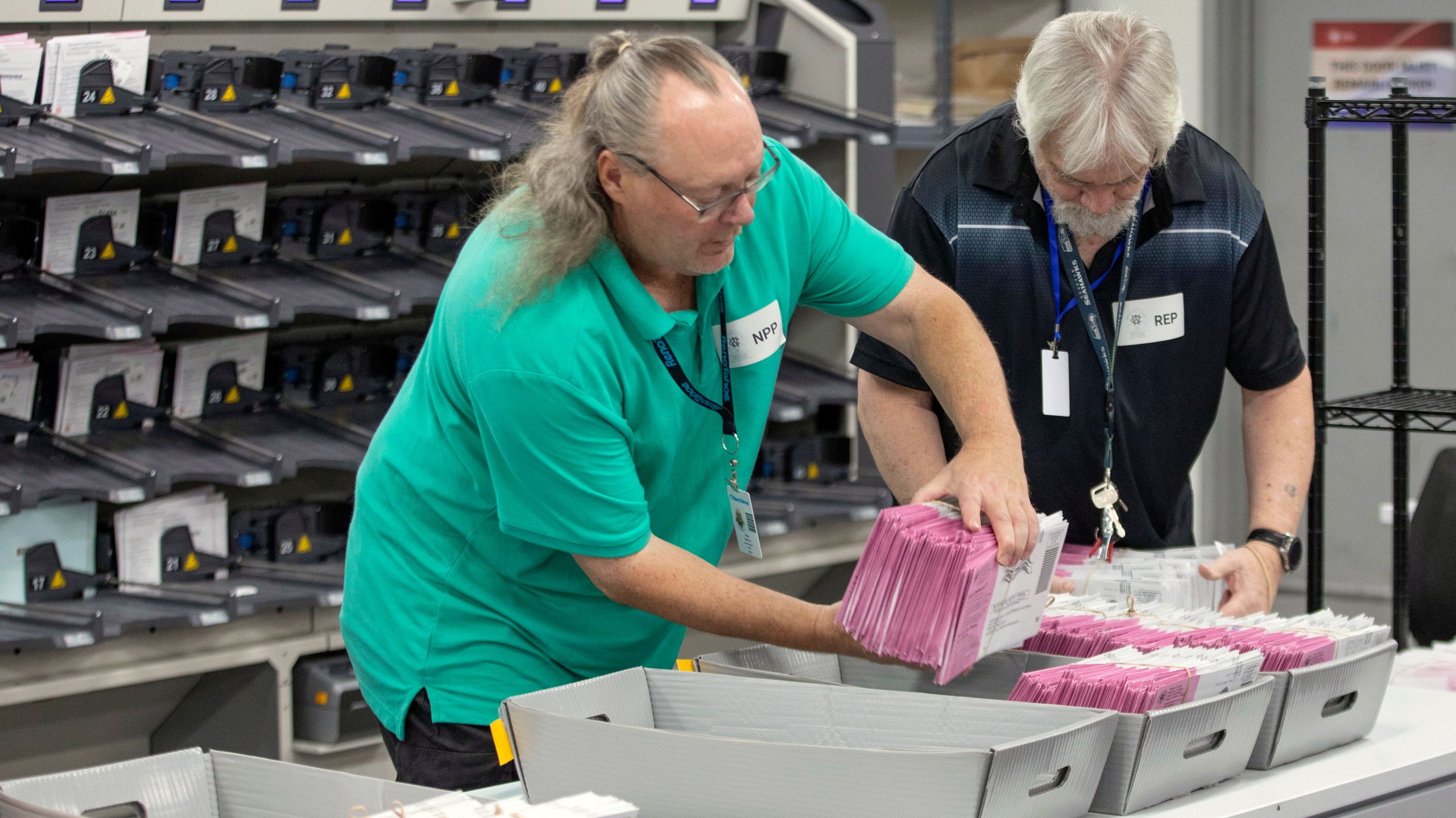 Washoe County election workers sort ballots at the Registrar of Voters Office in Reno, Nev., on Tuesday, Oct. 29, 2024. (AP Photo/Tom R. Smedes)