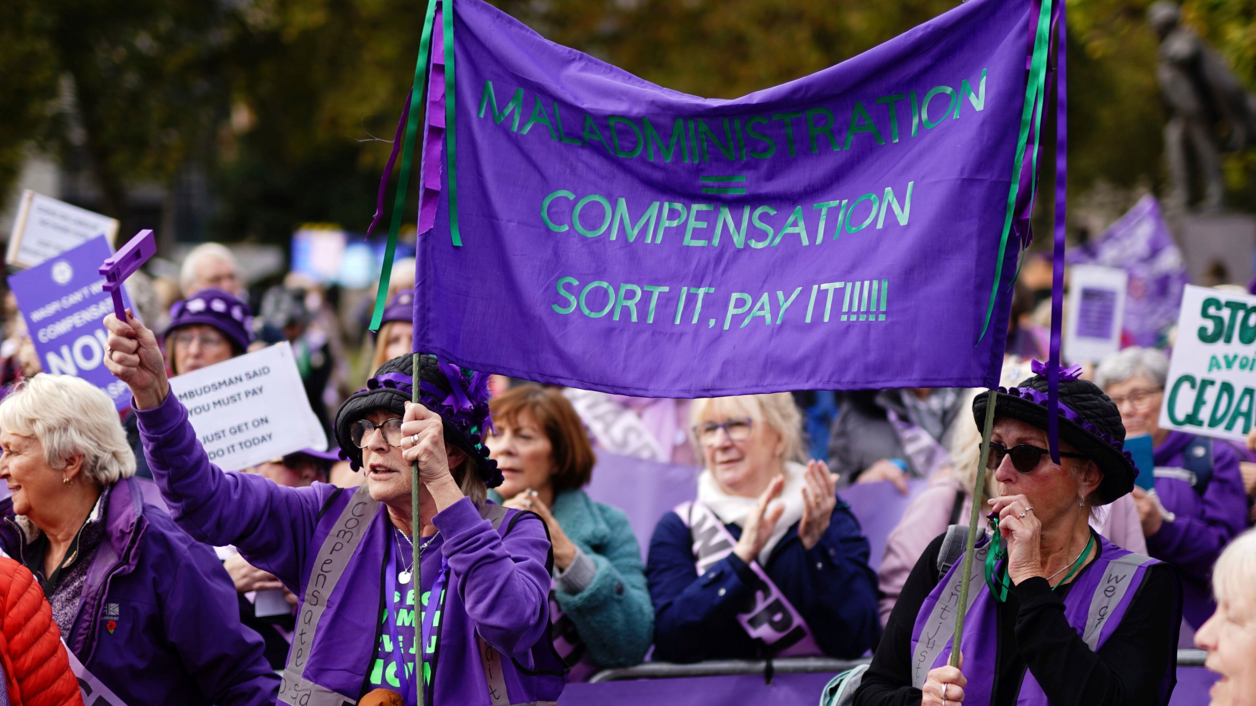 Waspi (Women Against State Pension Inequality) campaigners stage a protest on College Green in Westminster, London, as Chancellor of the Exchequer Rachel Reeves delivers her Budget in the Houses of Parliament, Wednesday, Oct. 30, 2024. (Jordan Pettitt/PA via AP)