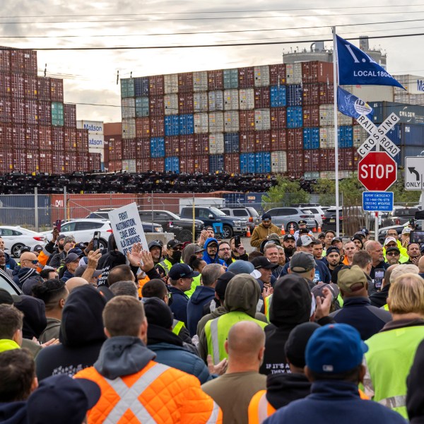 Workers take part in a port strike at Port Newark, Tuesday, Oct. 1, 2024, in Bayonne, N.J.