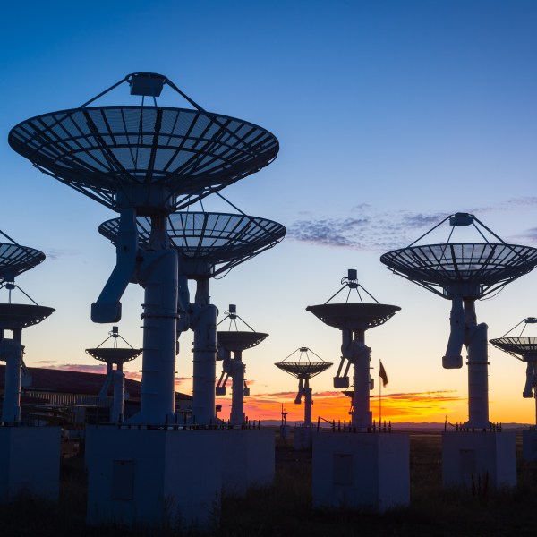 An observatory antenna in the sunset.