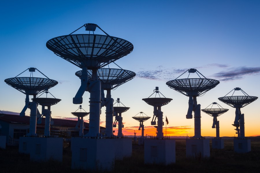 An observatory antenna in the sunset.