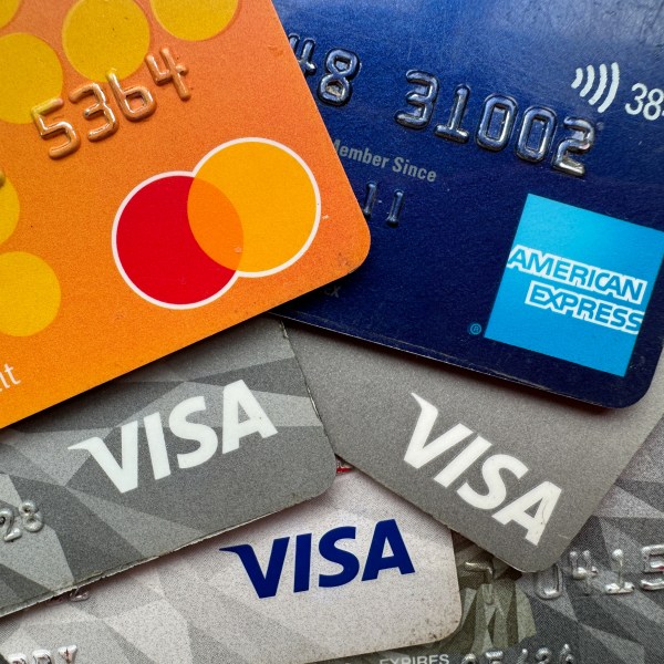 Visa, Mastercard and American Express logos are seen on credit and debit cards.