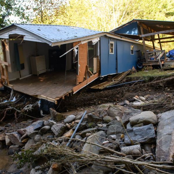 Damage to homes and vehicles along with evidence of re-routed streams can be seen on October 2, 2024 in Black Mountain, North Carolina.